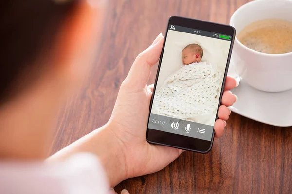 Person Hand Holding Babyphone — Stock fotografie