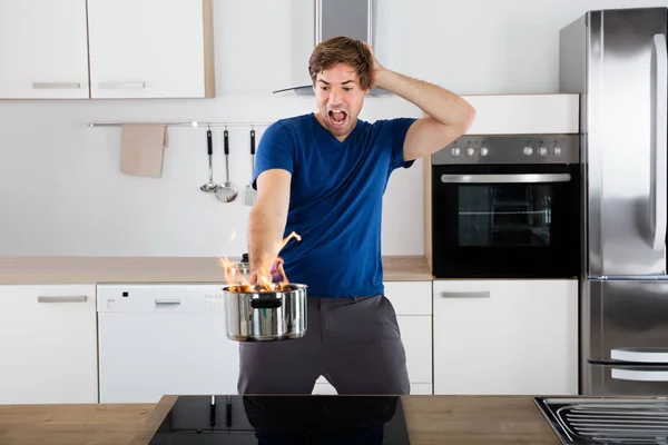 Man Holding Utensil — Stock Photo, Image