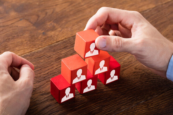 Block Of Team On Wooden Desk