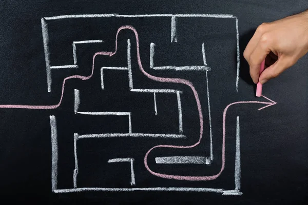 Person Solving Maze On Blackboard — Stock Photo, Image