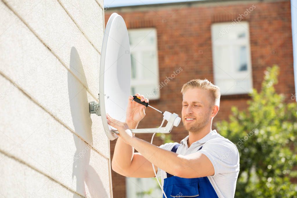Man Installing TV Satellite Dish