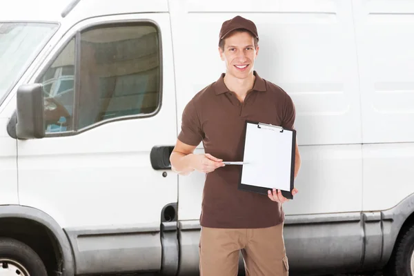 Delivery Man Holding Clipboard — Stock Photo, Image