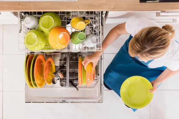 Woman Arranging Plates — Stock Photo, Image