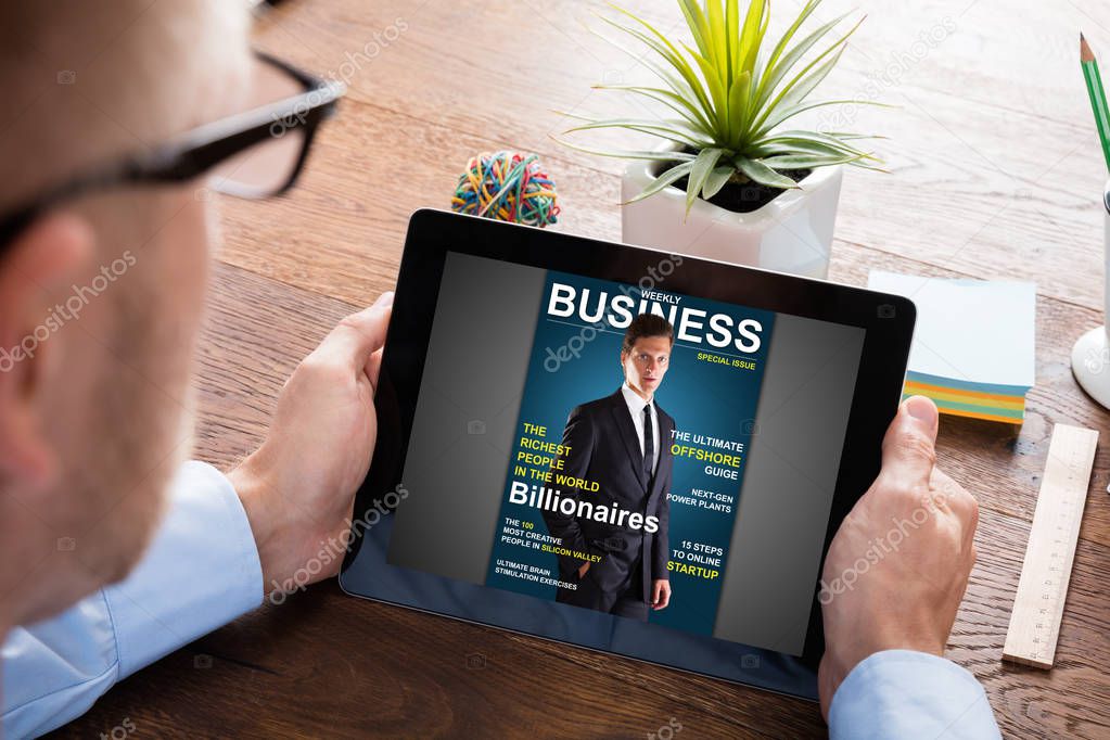 Businessman Reading Online Magazine 