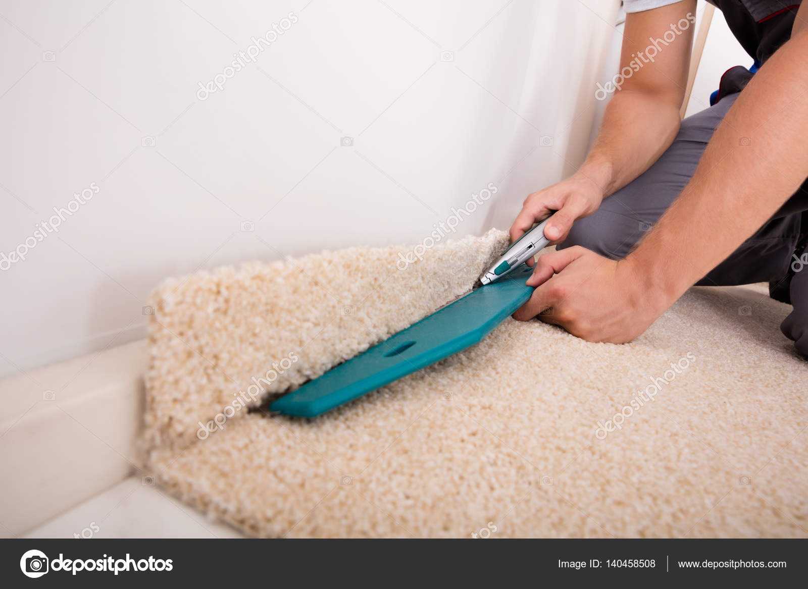 Craftsman Cutting Carpet Stock Photo by ©AndreyPopov 140458508