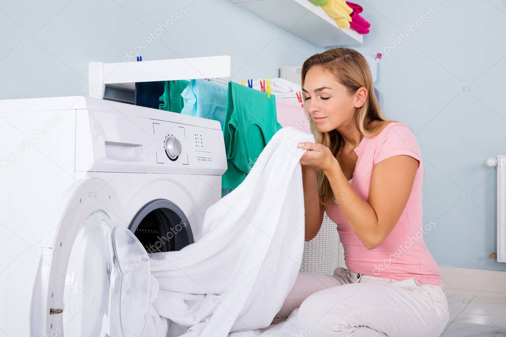  Woman Smelling Clean Clothes