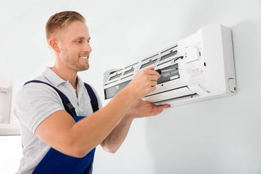 Technician Fixing Air Conditioner clipart