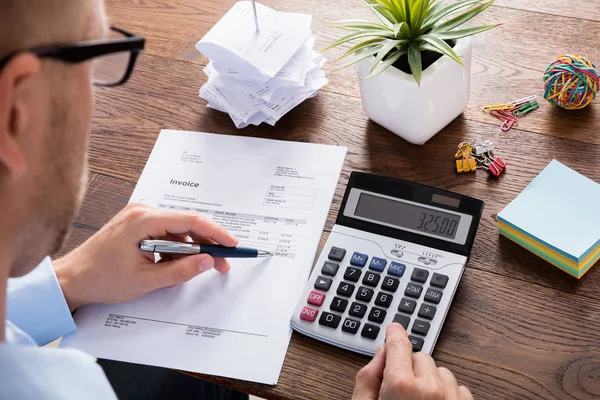 Businessman Calculating Invoice — Stock Photo, Image