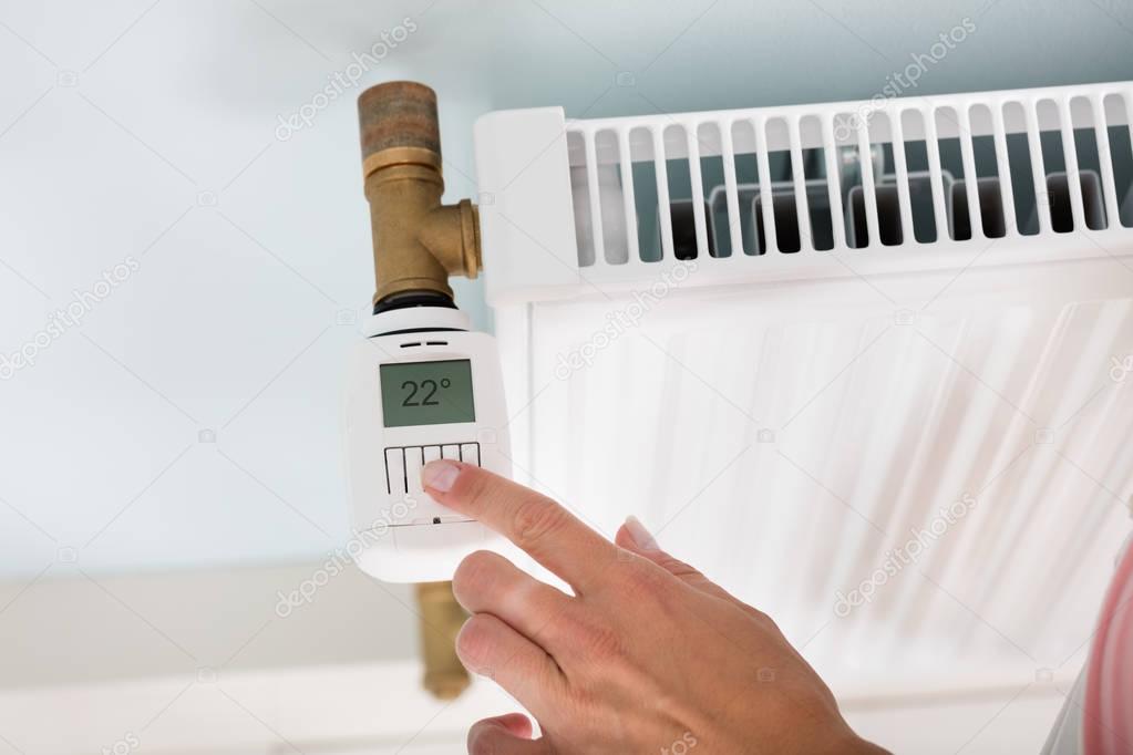 Person Adjusting Temperature