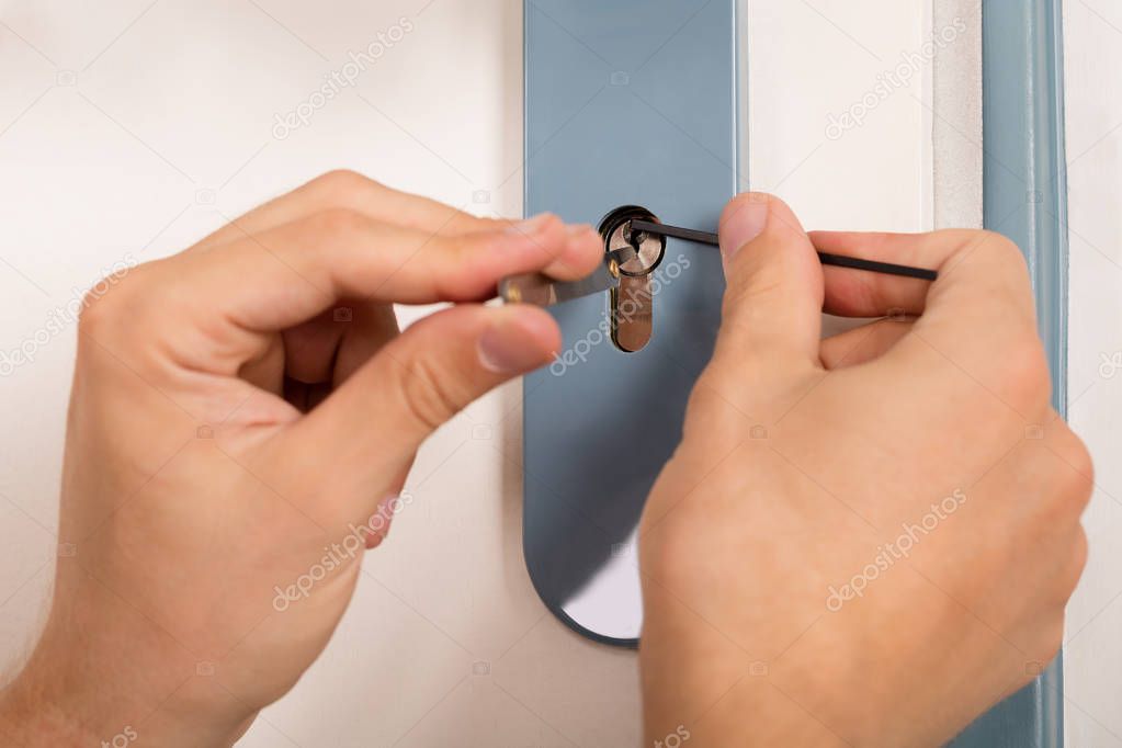 Person Inserting Lockpickers 