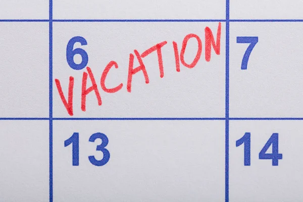 Vakantie Word geschreven op kalender — Stockfoto