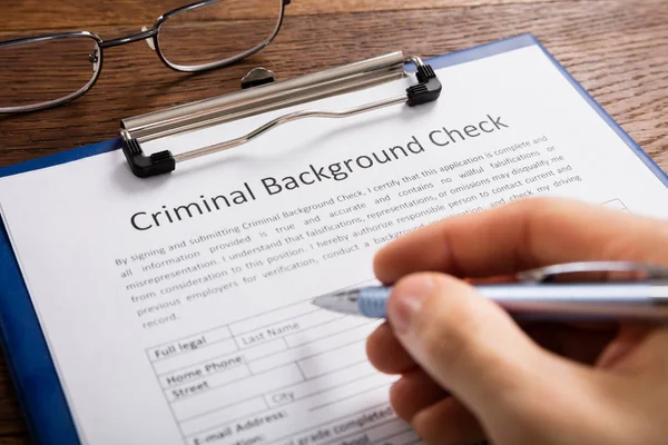 Person Filling Criminal Background Check — Stock Photo, Image