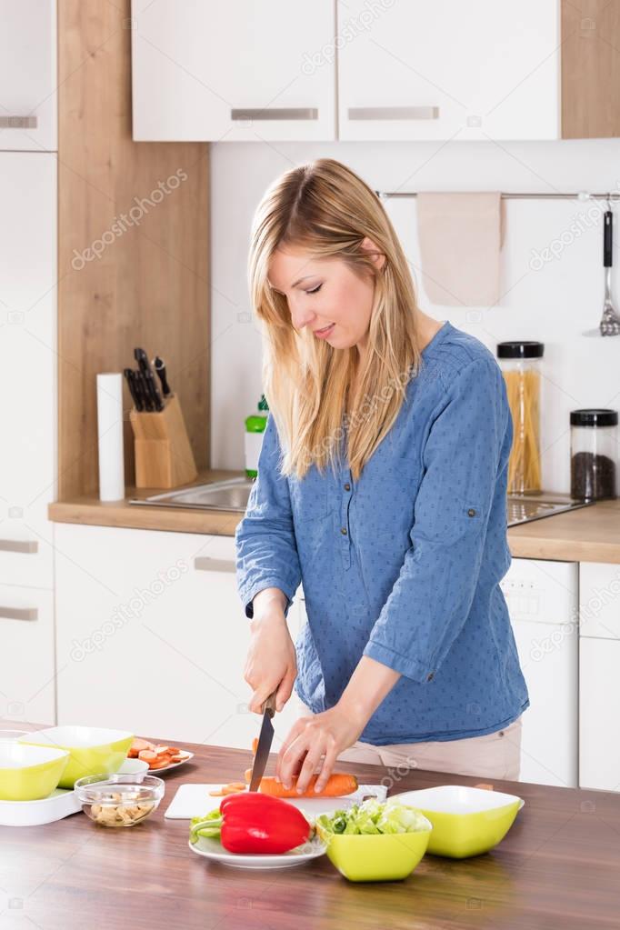 Woman Cutting Vegetable