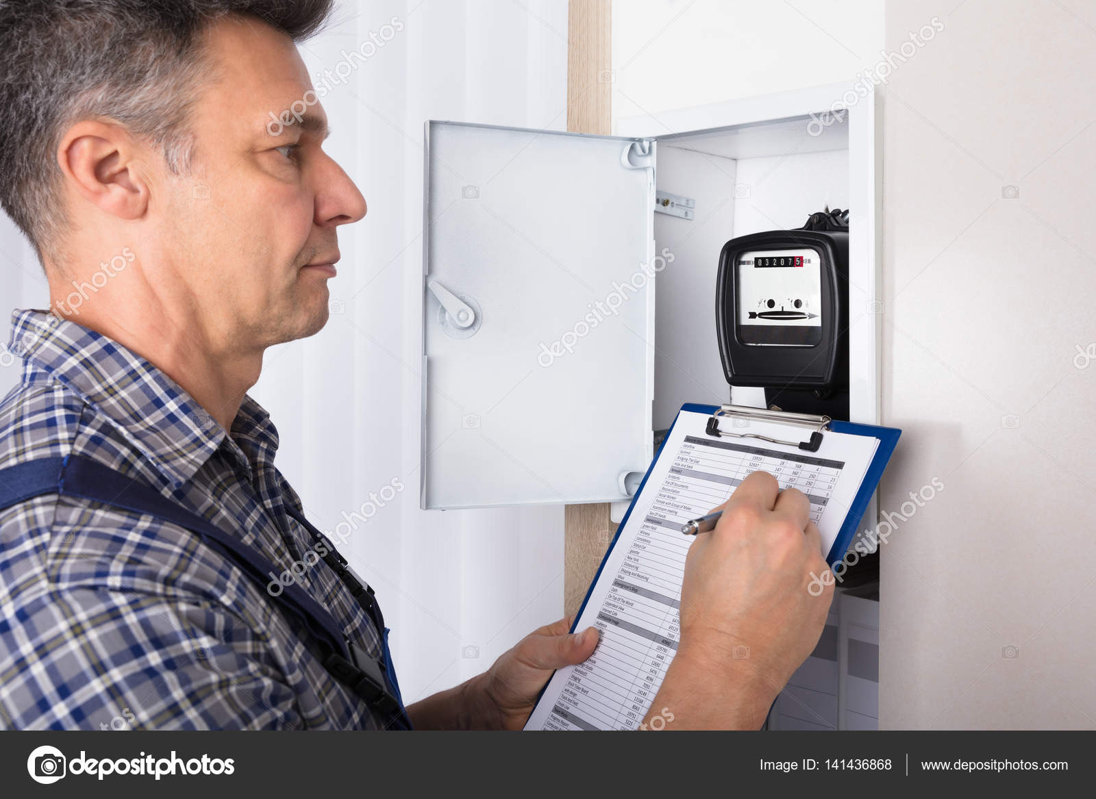 Technician checking meter indicators — Stock Photo © AndreyPopov 141436868
