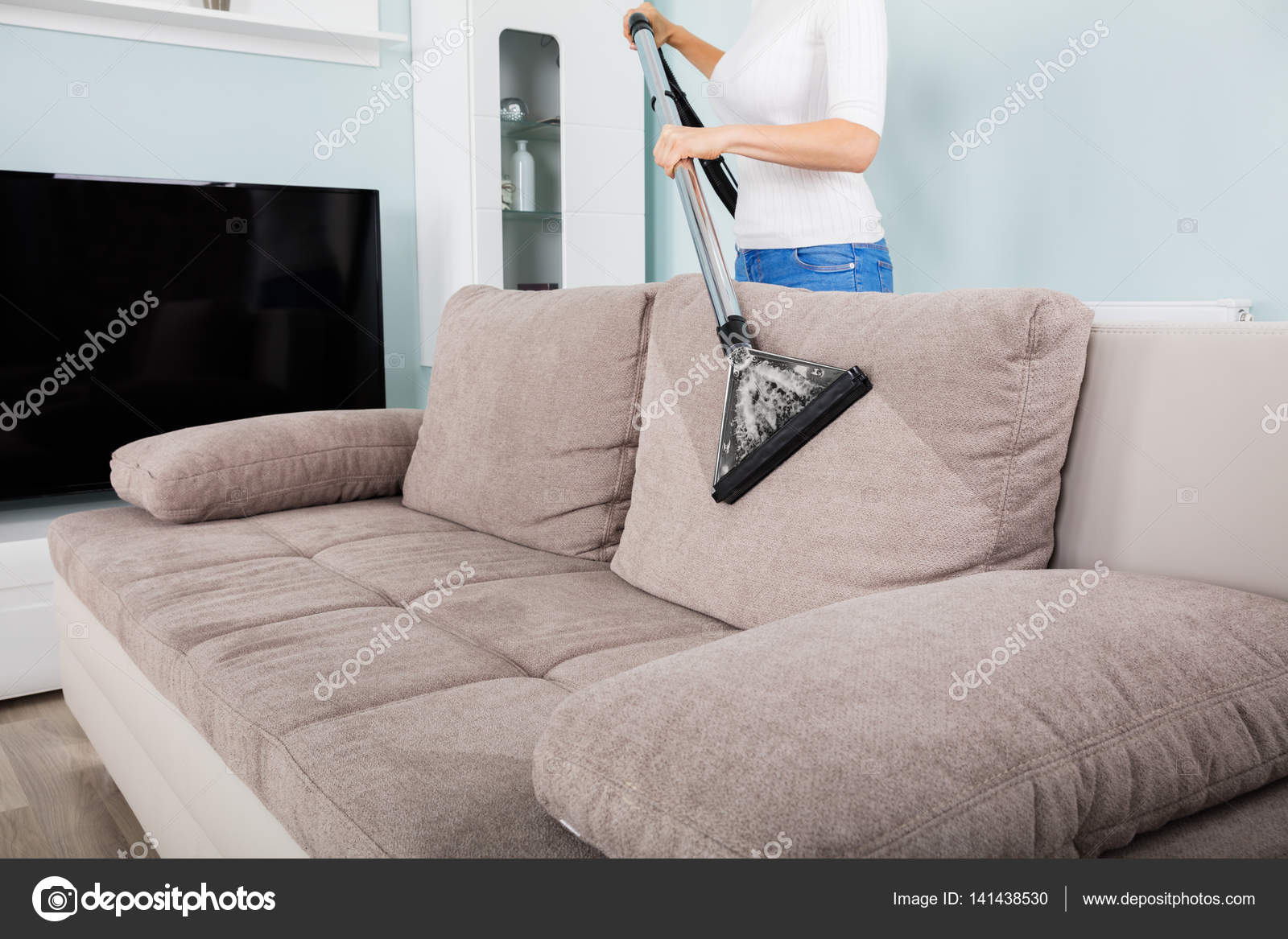 Woman Cleaning Sofa With Vacuum Cleaner, How To Clean Sofa At Home With Vacuum Cleaner