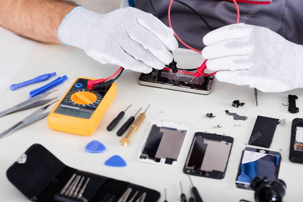 Technician Repairing MobilePhone