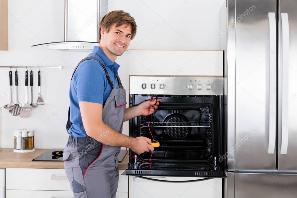 Technician Checking Oven