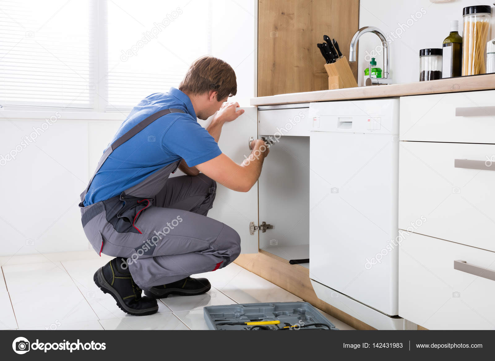 Repairman Fixing Cabinet Hinge Stock Photo C Andreypopov 142431983