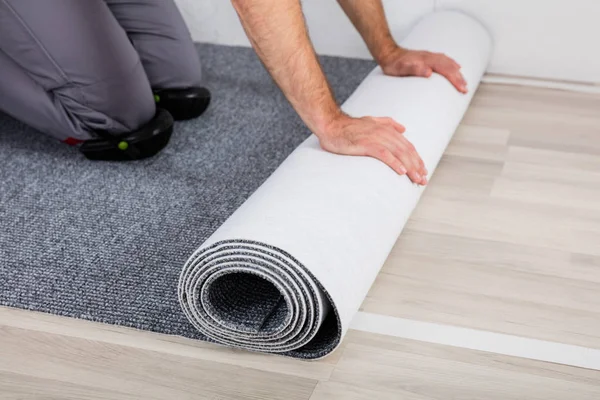 Hands Rolling Carpet — Stock Photo, Image