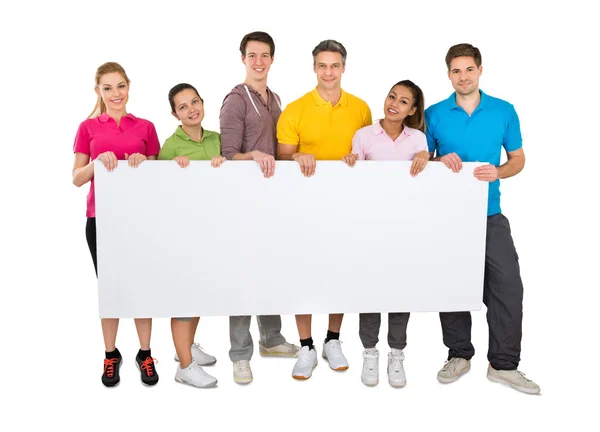 Group Smiling People Holding Blank Banner Front White Background — Stock Photo, Image