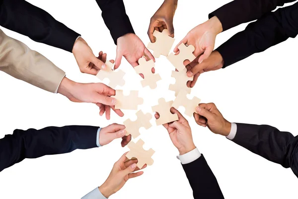 Businesspeople Hands Holding Puzzles — Stock Photo, Image