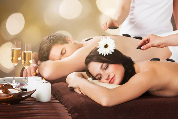 Young Couple Receiving Hot Stone Therapy — Stock Photo, Image