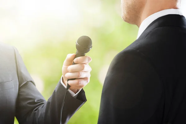 Reporter Conducting Interview Of Businessman — Stock Photo, Image