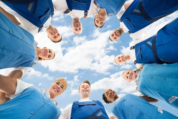 Janitors Standing In Huddle — Stock Photo, Image