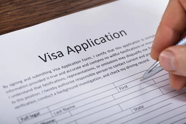 Hand Filling Visa Application Form