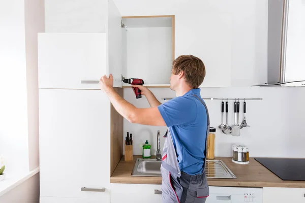 Door Cabinet Repair Stock Photos Royalty Free Images Depositphotos Door Cabinet Repair Stock Photos, Carpenter Kitchen Cabinet Repair