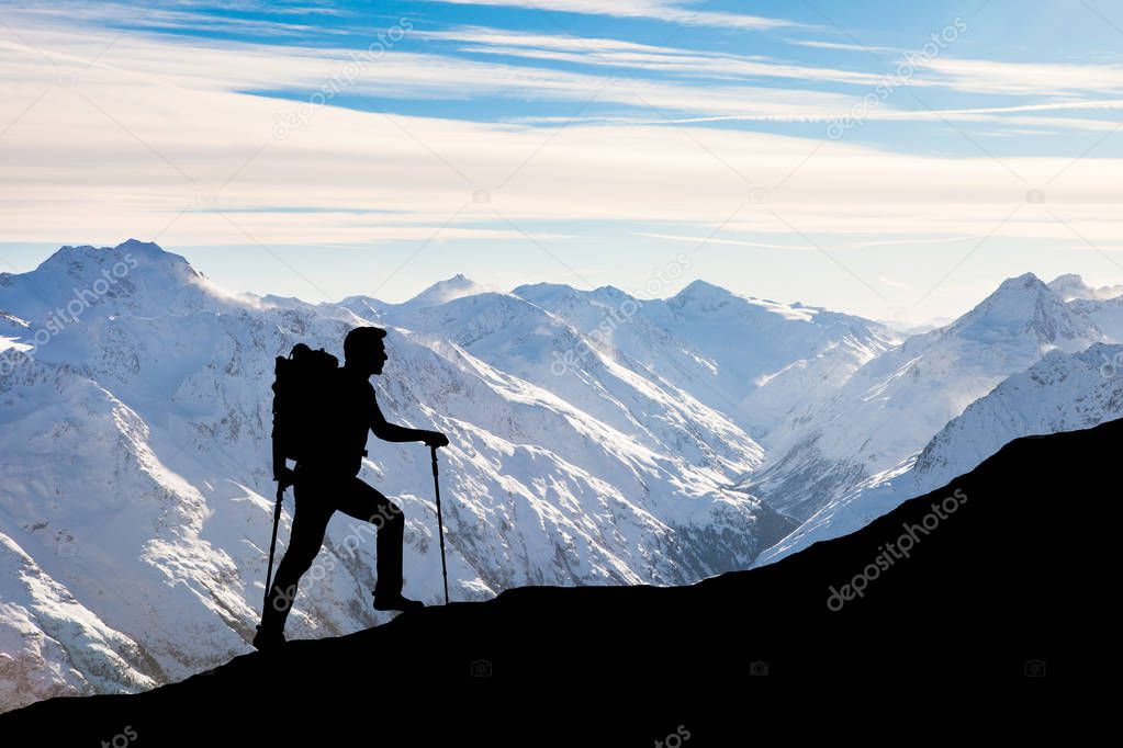 Man Climbing On Rocky Mountain