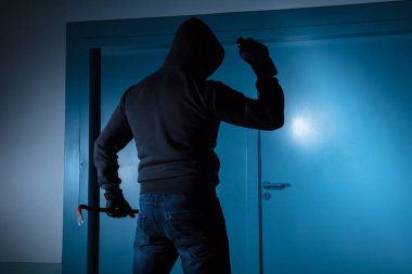 Thief Standing Outside Door clipart