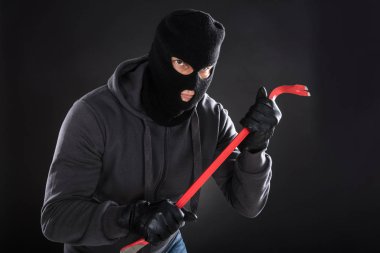 Burglar In Mask With Crowbar clipart