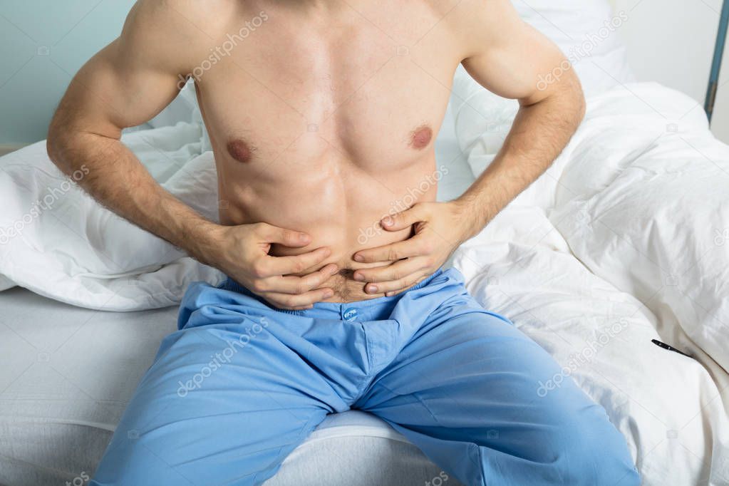 Man Suffering From Stomach Ache