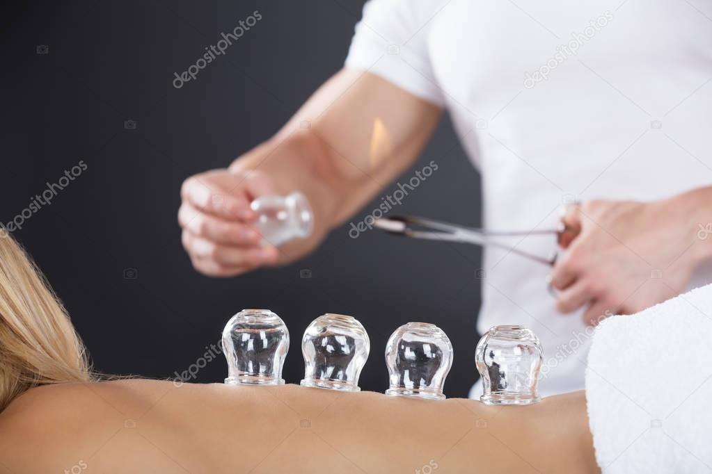 Woman Receiving Cupping Treatment