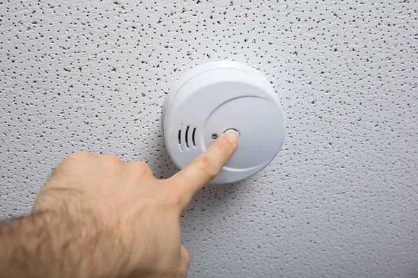 Person Pressing Smoke Detector — Stock Photo, Image