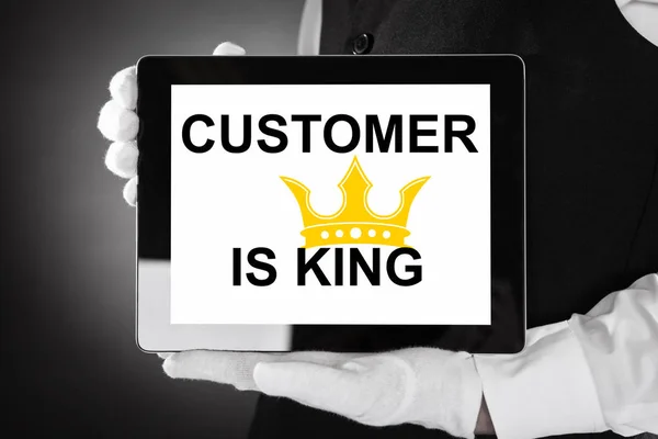 Pessoa exibindo cliente é rei — Fotografia de Stock