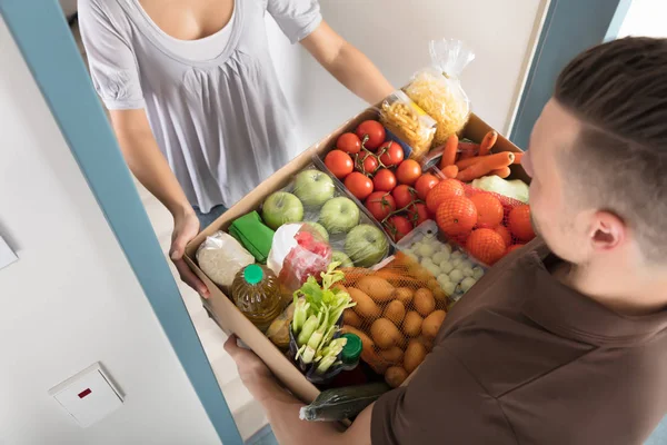Woman Accepting Groceries — Stock Photo, Image