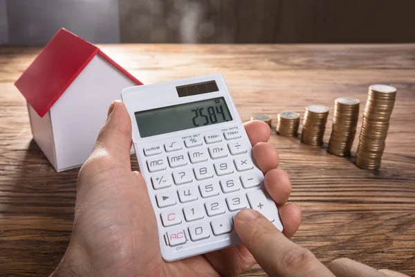 Person Calculating With House Model — Stock Photo, Image