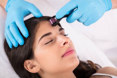 woman having facial treatment clipart