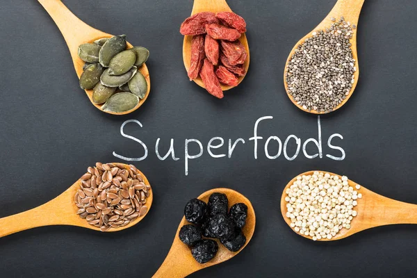 Superfoods Text With Ingredients In A Wooden Spoon — Stock Photo, Image