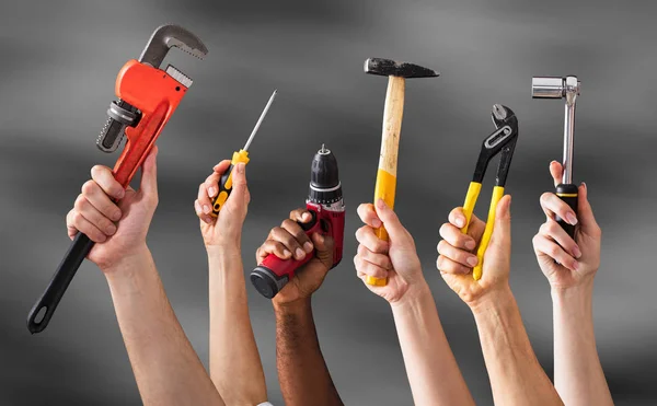 Hands Holding Work Tools — Stock Photo, Image