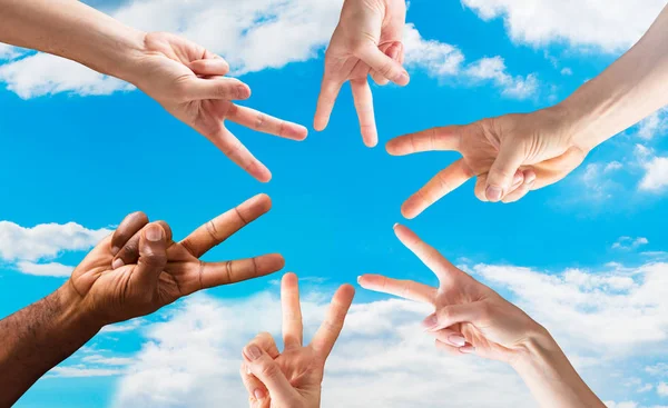 Group Hands Showing Signs Peace Blue Sky Circle — стоковое фото