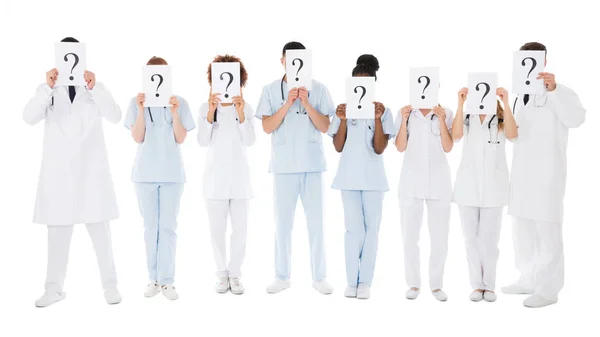 Doctors Hiding Behind Signs — Stock Photo, Image