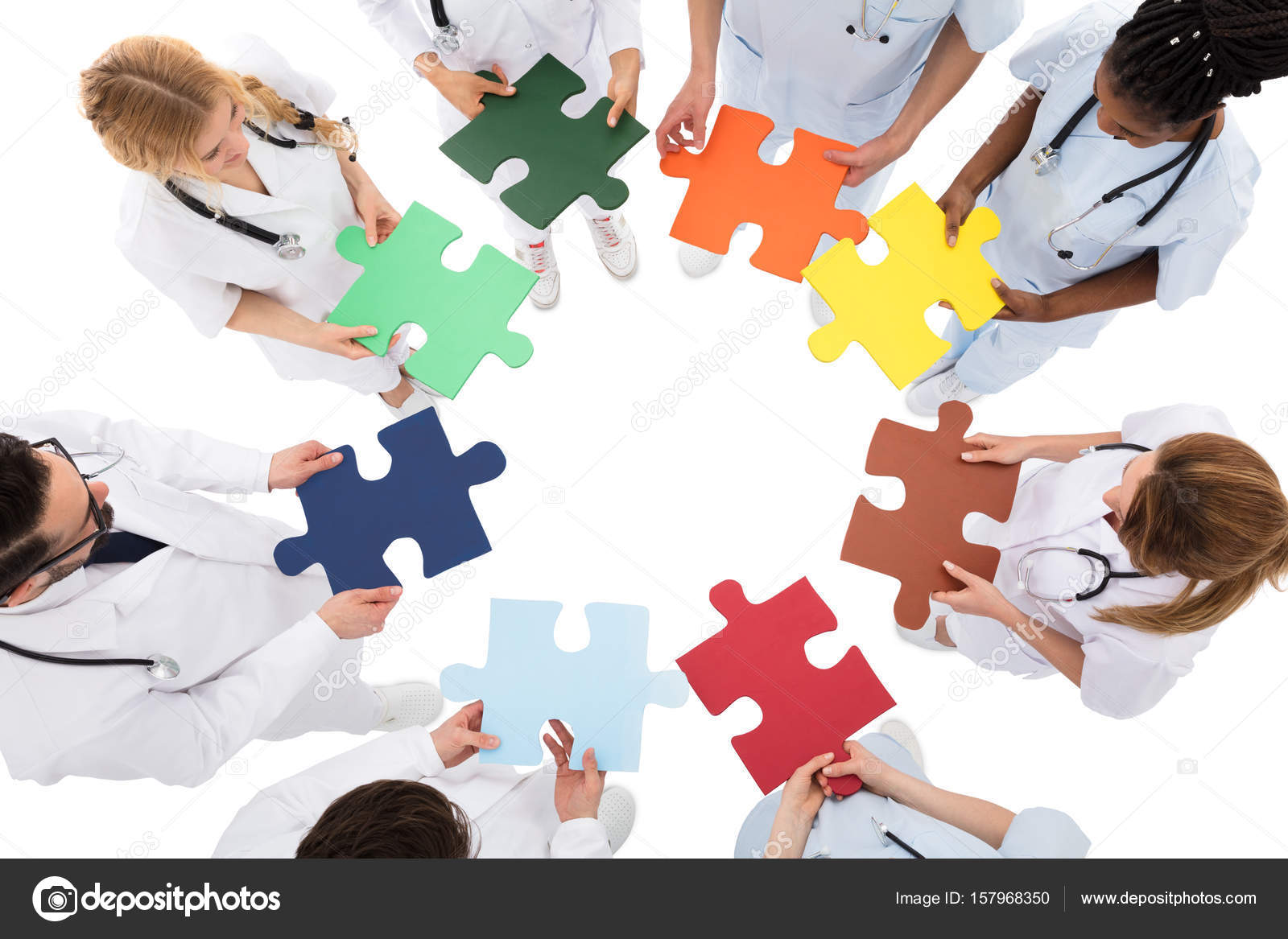 Group Of People Holding Puzzles Stock Photo by ©AndreyPopov 157968350
