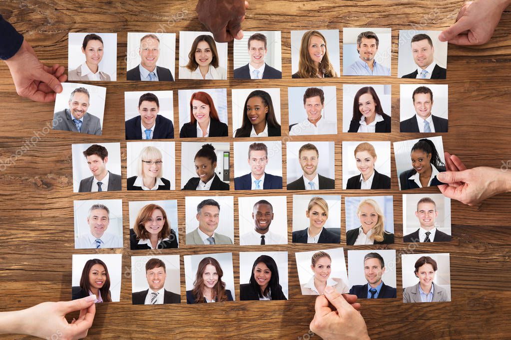 Businesspeople Hands Selecting The Candidate Portrait Photo For Hiring In Job