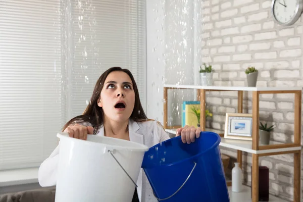 Woman Holding Two Buckets