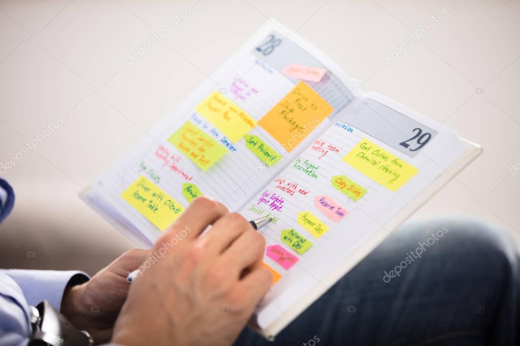 Man Writing Notes 