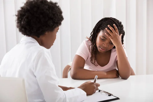 Female Doctor Comforting Patient