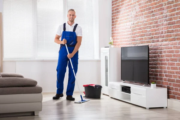 Male Janitor Sweeping Floor — Stock Photo, Image